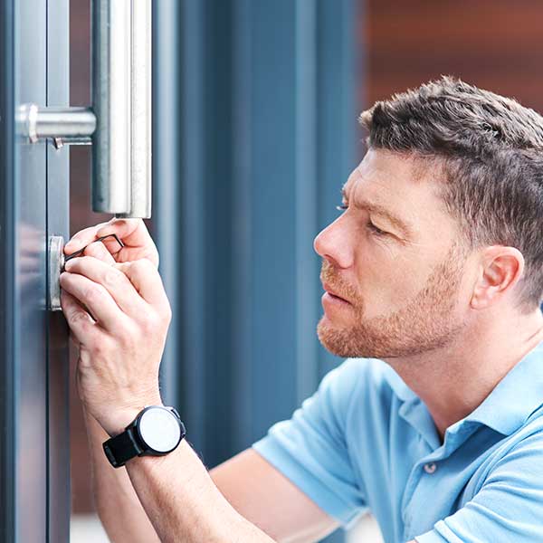 Man opening door lock